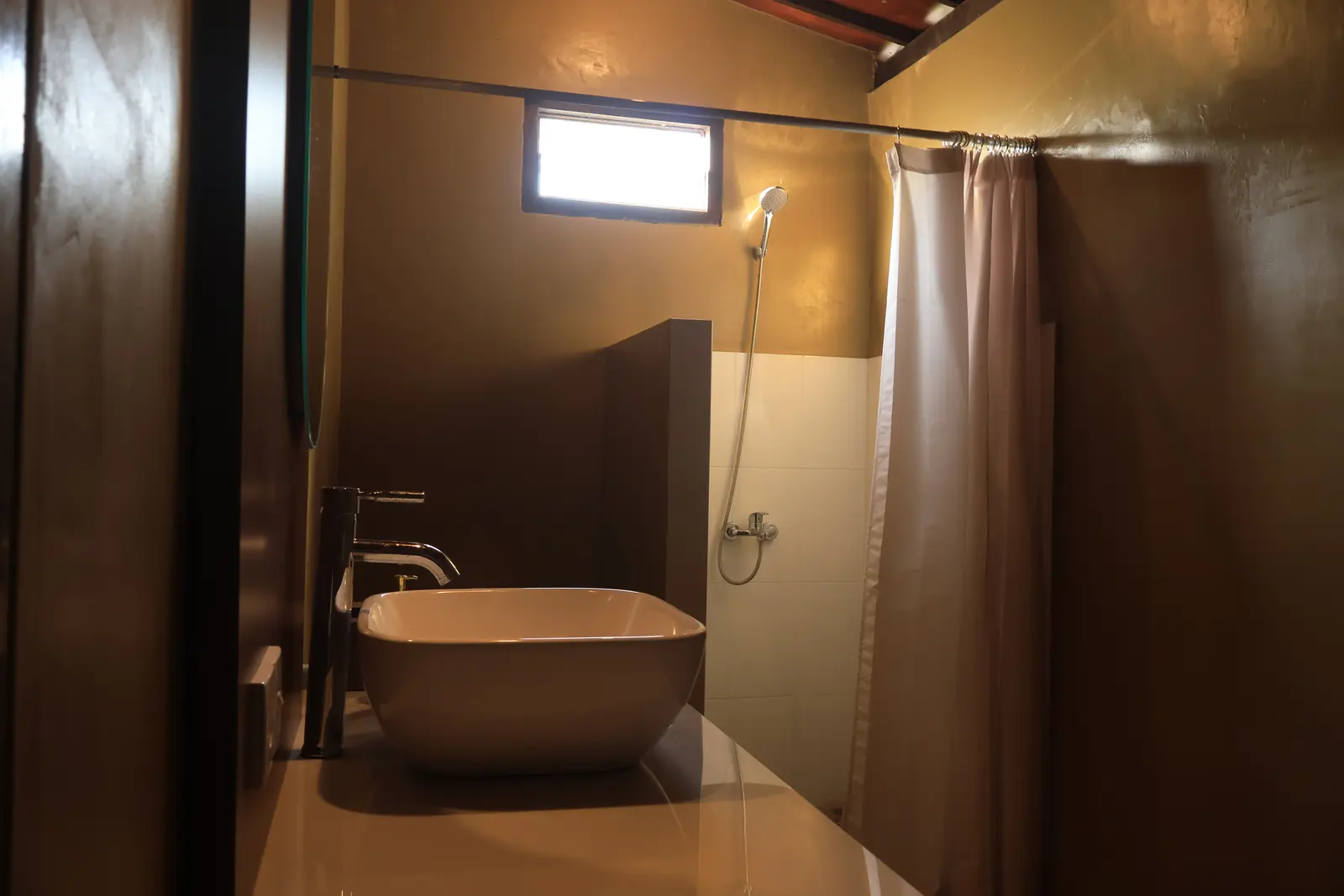 Private bathroom with bath and shower